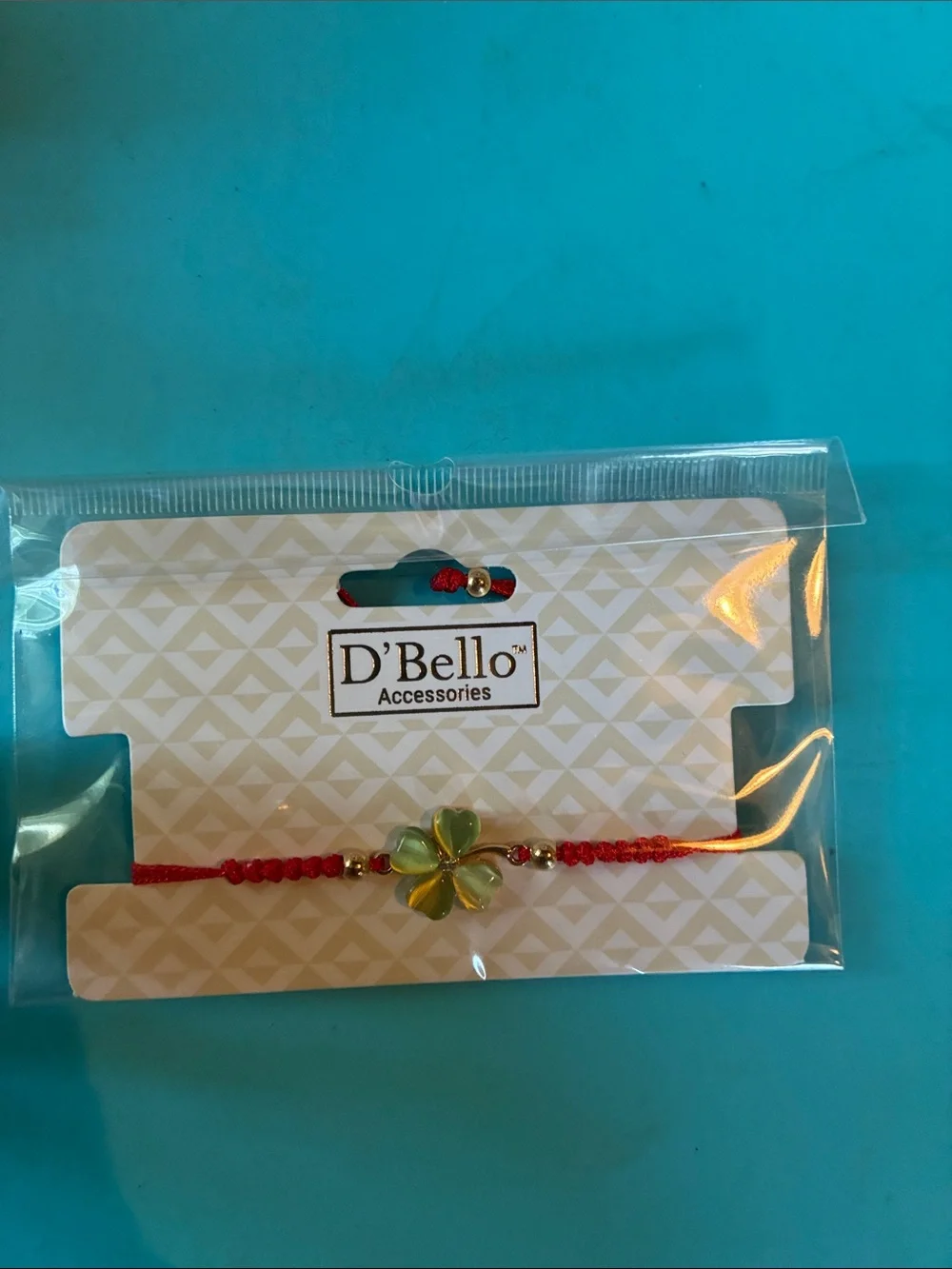 D'Bello Red Braided Bracelet with Green Four-Leaf Flower Charm